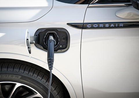 A 2023 Lincoln Corsair® Grand Touring model is shown being charged via the driver’s side charging port. | Cavalier Lincoln in Chesapeake VA