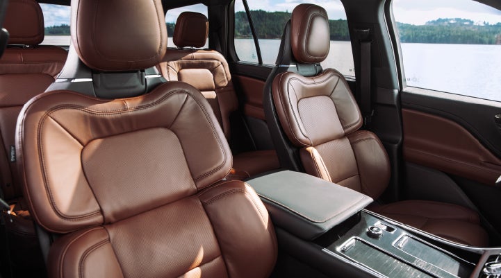 The front row's Perfect Position Seats in a 2024 Lincoln Aviator® Reserve model with Ebony Roast interior | Cavalier Lincoln in Chesapeake VA